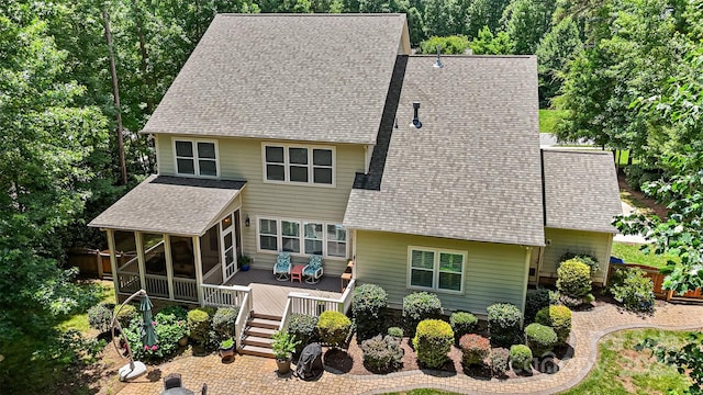 6422 Northern Red Oak Dr, Mint Hill, NC 28227 - back of house featuring a sunroom, a deck, and a shingled roof
