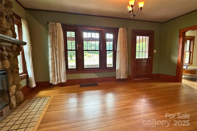 4320 Pisgah Dr, Canton, NC 28716 - foyer featuring light wood-style floors, a fireplace, and baseboards
