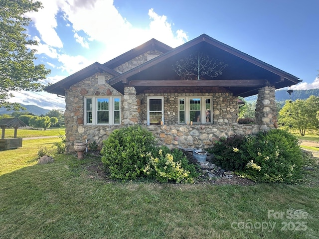 4320 Pisgah Dr, Canton, NC 28716 - view of front of house featuring stone siding, a front lawn, and central AC unit