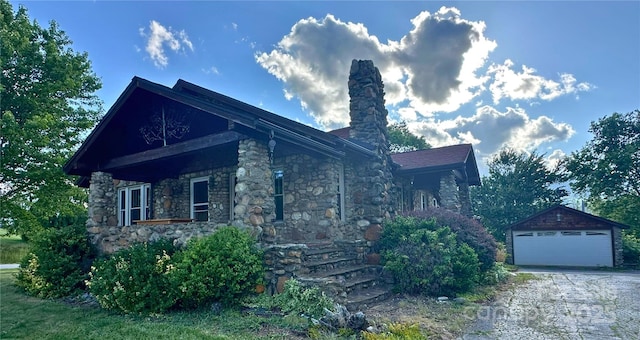 4320 Pisgah Dr, Canton, NC 28716 - view of side of property featuring a detached garage, a chimney, an outbuilding, stone siding, and covered porch