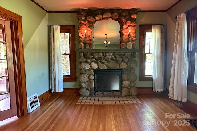 4320 Pisgah Dr, Canton, NC 28716 - unfurnished living room with ornamental molding, wood finished floors, baseboards, and a fireplace