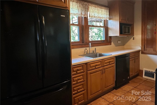 4320 Pisgah Dr, Canton, NC 28716 - kitchen featuring black appliances, a sink, light countertops, and light tile patterned floors