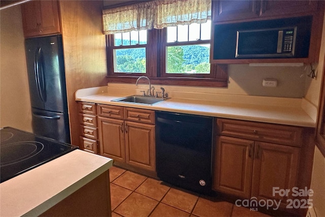 4320 Pisgah Dr, Canton, NC 28716 - kitchen featuring black appliances, a sink, light tile patterned flooring, and light countertops