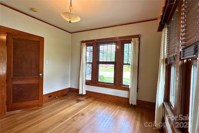 4320 Pisgah Dr, Canton, NC 28716 - unfurnished room with baseboards, light wood-style floors, ornamental molding, and a smoke detector