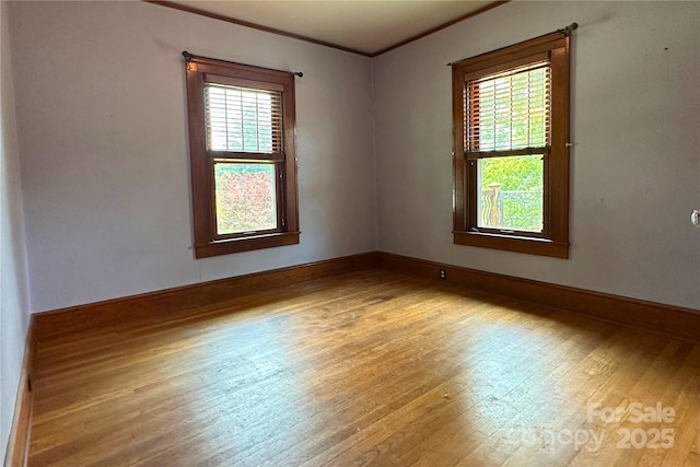 4320 Pisgah Dr, Canton, NC 28716 - unfurnished room featuring light wood finished floors, healthy amount of natural light, ornamental molding, and baseboards
