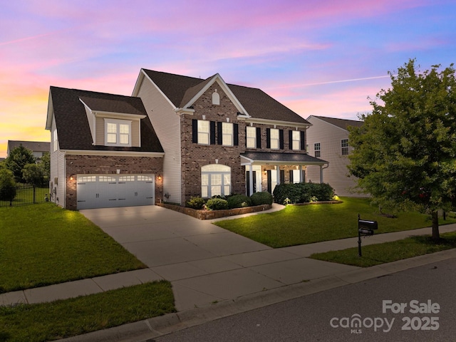 9937 Violet Cannon Dr NW, Concord, NC 28027 - view of front of home featuring brick siding, concrete driveway, and an attached garage