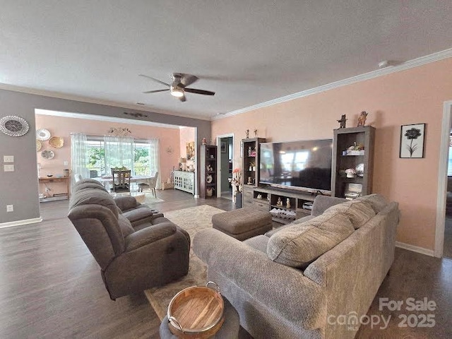 16115 Commodore Dr, Lancaster, SC 29720 - living area featuring ornamental molding, wood finished floors, baseboards, and a ceiling fan