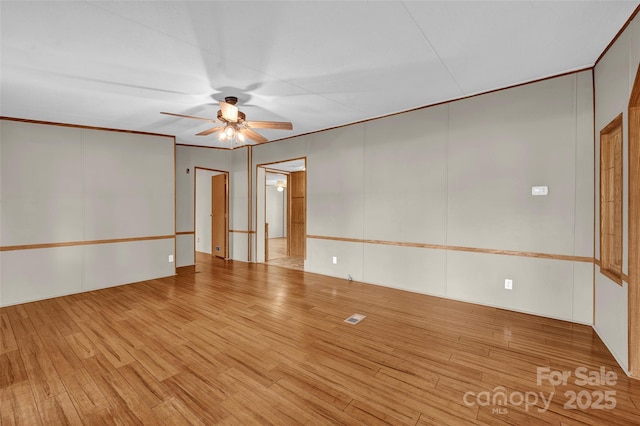 1532 Buffalo Shoals Rd, Claremont, NC 28610 - unfurnished room featuring ceiling fan, wood finished floors, and crown molding