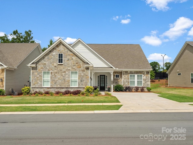 6020 Waldorf Ave, Monroe, NC 28110 - view of front facade with stone siding, a front yard, and concrete driveway