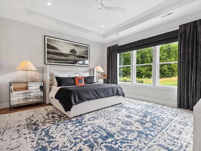 6020 Waldorf Ave, Monroe, NC 28110 - bedroom with a tray ceiling, recessed lighting, a ceiling fan, and wood finished floors
