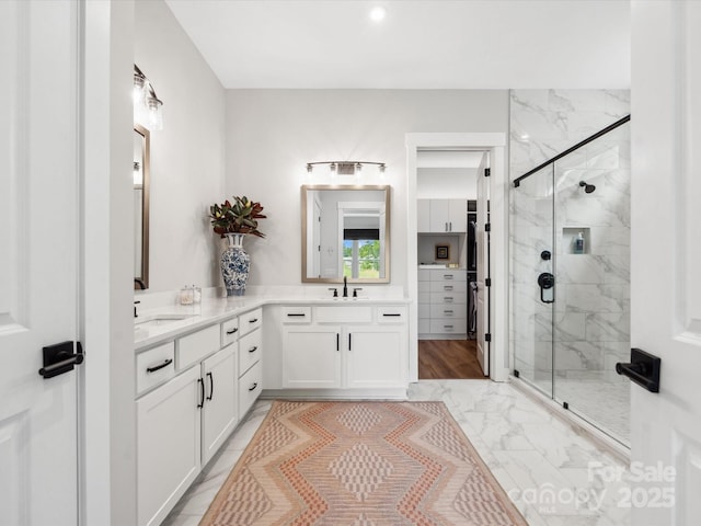 6020 Waldorf Ave, Monroe, NC 28110 - bathroom with marble look tile flooring, a marble finish shower, and double vanity