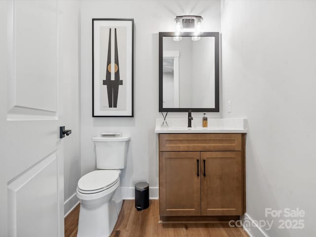 6020 Waldorf Ave, Monroe, NC 28110 - half bathroom with vanity and wood finished floors