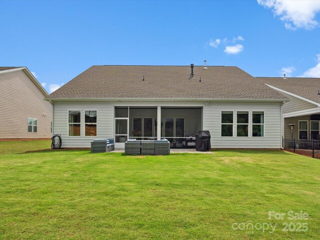 6020 Waldorf Ave, Monroe, NC 28110 - back of property with a lawn, a sunroom, and a shingled roof