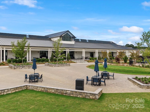 6020 Waldorf Ave, Monroe, NC 28110 - view of property's community featuring a patio area and a lawn