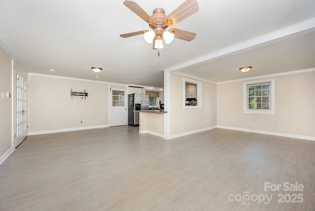 158 John Crotts Rd, Mocksville, NC 27028 - unfurnished living room featuring wood finished floors, baseboards, ornamental molding, and ceiling fan