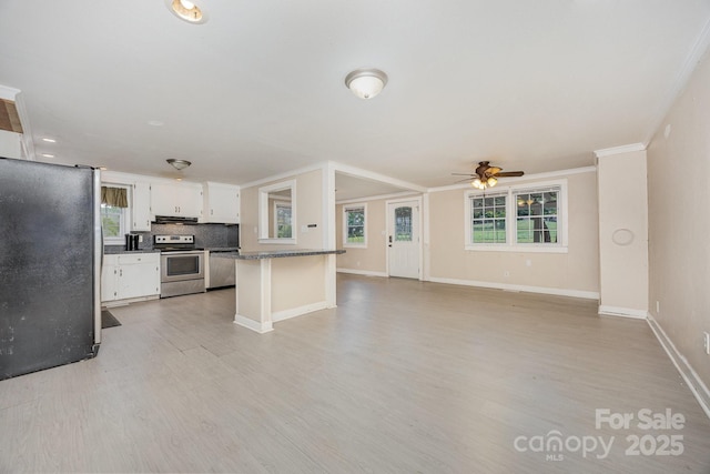 158 John Crotts Rd, Mocksville, NC 27028 - kitchen featuring stainless steel appliances, dark countertops, ceiling fan, white cabinets, and light wood-type flooring