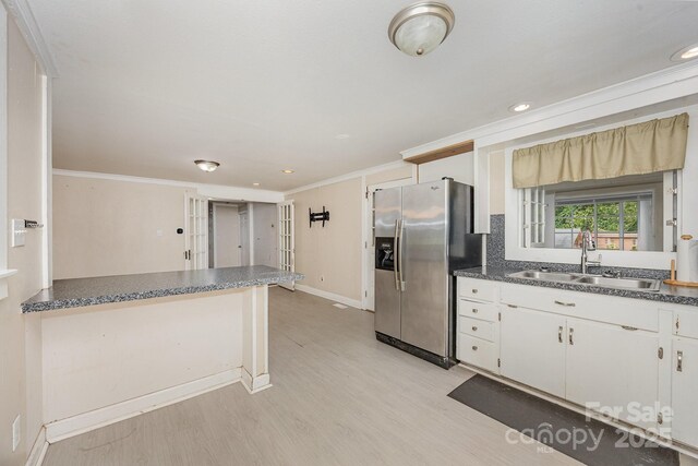 158 John Crotts Rd, Mocksville, NC 27028 - kitchen with stainless steel fridge with ice dispenser, a sink, ornamental molding, light wood-style flooring, and baseboards