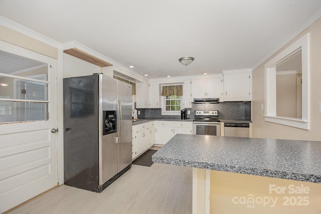 158 John Crotts Rd, Mocksville, NC 27028 - kitchen featuring appliances with stainless steel finishes, ventilation hood, light wood-style floors, white cabinetry, and ornamental molding