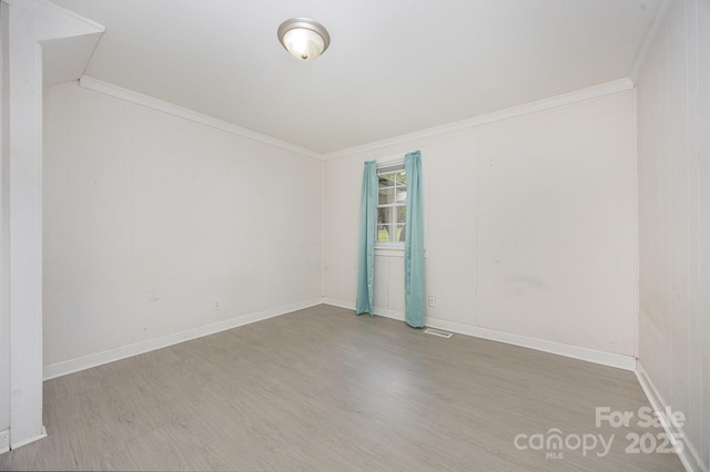 158 John Crotts Rd, Mocksville, NC 27028 - empty room featuring wood finished floors and crown molding