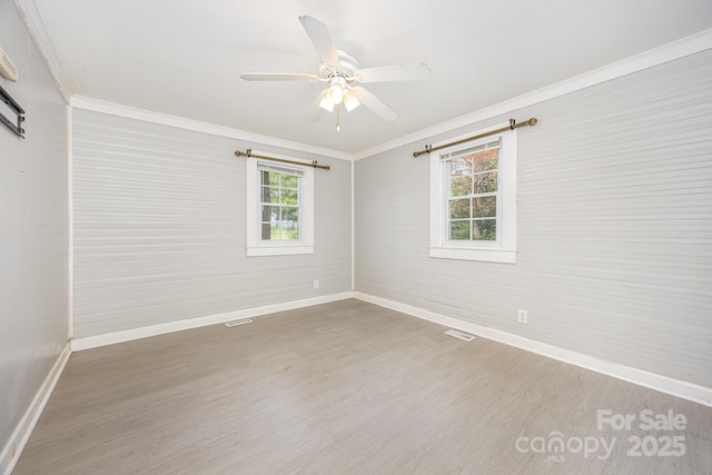 158 John Crotts Rd, Mocksville, NC 27028 - unfurnished room with crown molding, baseboards, wood finished floors, and ceiling fan