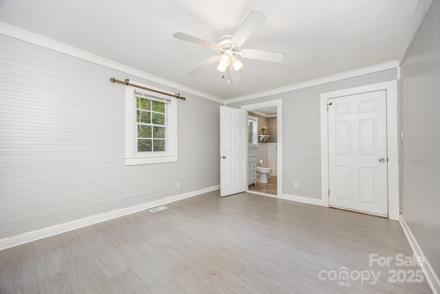 158 John Crotts Rd, Mocksville, NC 27028 - unfurnished bedroom featuring baseboards, crown molding, wood finished floors, ensuite bathroom, and ceiling fan