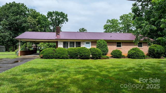 4214 Horseshoe Bend Rd, Hudson, NC 28638 - single story home with a carport, a front yard, metal roof, driveway, and brick siding