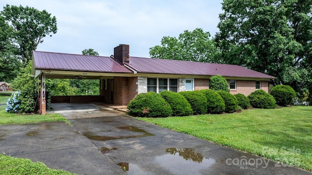 4214 Horseshoe Bend Rd, Hudson, NC 28638 - ranch-style house with a chimney, a front yard, metal roof, and brick siding