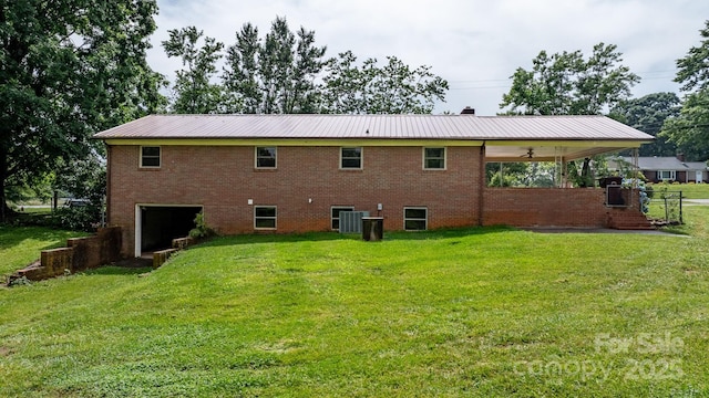 4214 Horseshoe Bend Rd, Hudson, NC 28638 - rear view of property with a lawn, a garage, and metal roof