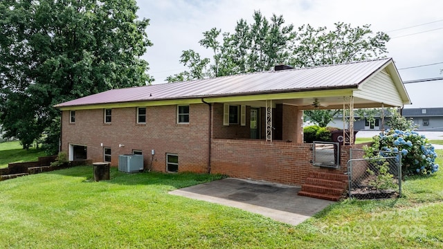 4214 Horseshoe Bend Rd, Hudson, NC 28638 - rear view of house with central air condition unit, a lawn, a carport, a ceiling fan, and metal roof