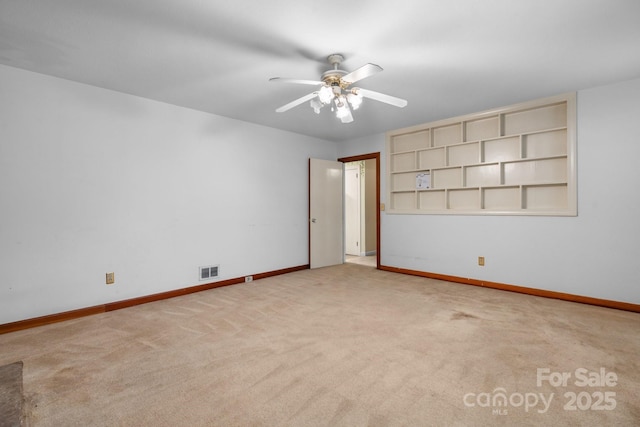 4214 Horseshoe Bend Rd, Hudson, NC 28638 - empty room with baseboards, carpet floors, a ceiling fan, and built in shelves