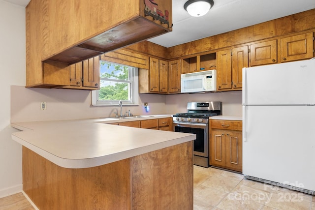 4214 Horseshoe Bend Rd, Hudson, NC 28638 - kitchen featuring white appliances, a peninsula, a sink, brown cabinets, and light countertops