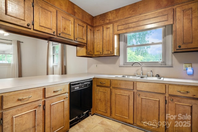 4214 Horseshoe Bend Rd, Hudson, NC 28638 - kitchen with dishwasher, a sink, and brown cabinetry