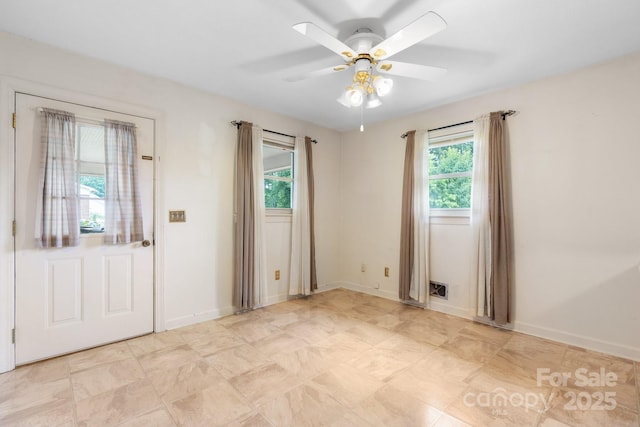 4214 Horseshoe Bend Rd, Hudson, NC 28638 - empty room with plenty of natural light, a ceiling fan, and baseboards