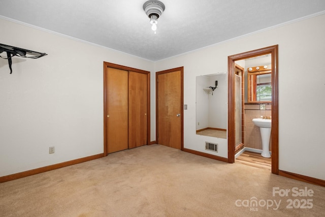 4214 Horseshoe Bend Rd, Hudson, NC 28638 - unfurnished bedroom with light carpet, baseboards, crown molding, and ensuite bath