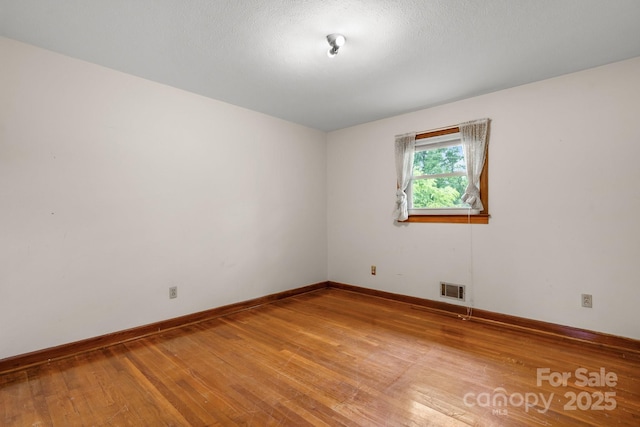 4214 Horseshoe Bend Rd, Hudson, NC 28638 - empty room featuring light wood-style floors and baseboards