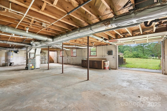 4214 Horseshoe Bend Rd, Hudson, NC 28638 - basement featuring heating unit, stairs, and gas water heater
