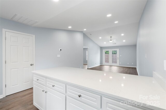 2045 Pin Oak Pl, Cramerton, NC 28032 - kitchen featuring light wood finished floors, light countertops, white cabinets, recessed lighting, and open floor plan