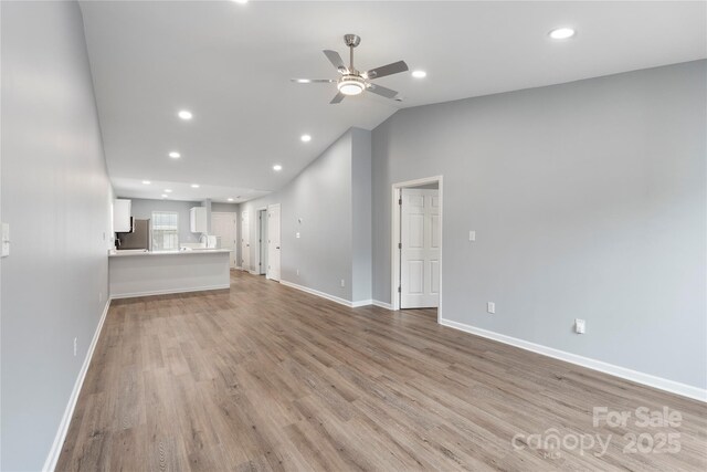 2045 Pin Oak Pl, Cramerton, NC 28032 - unfurnished living room with a ceiling fan, light wood-style flooring, recessed lighting, and vaulted ceiling