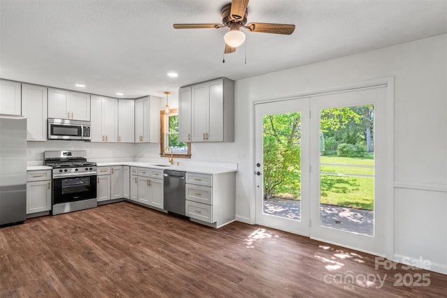4980 Murray Rd, Winston Salem, NC 27106 - kitchen with stainless steel appliances, gray cabinets, light countertops, ceiling fan, and recessed lighting