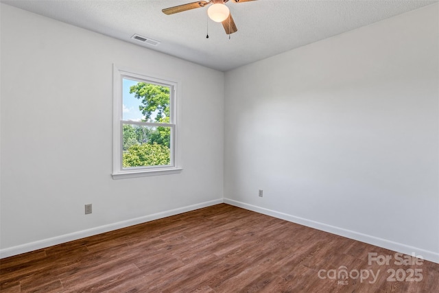 4980 Murray Rd, Winston Salem, NC 27106 - spare room with wood finished floors, baseboards, a ceiling fan, and a textured ceiling