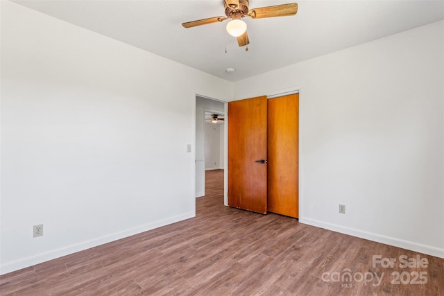 4980 Murray Rd, Winston Salem, NC 27106 - spare room featuring baseboards, wood finished floors, and ceiling fan