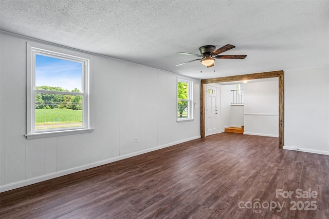 4980 Murray Rd, Winston Salem, NC 27106 - empty room featuring wood finished floors, healthy amount of natural light, ceiling fan, baseboards, and a textured ceiling