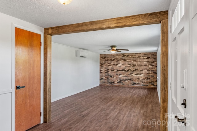 4980 Murray Rd, Winston Salem, NC 27106 - unfurnished room featuring a wall mounted AC, brick wall, ceiling fan, a textured ceiling, and wood finished floors