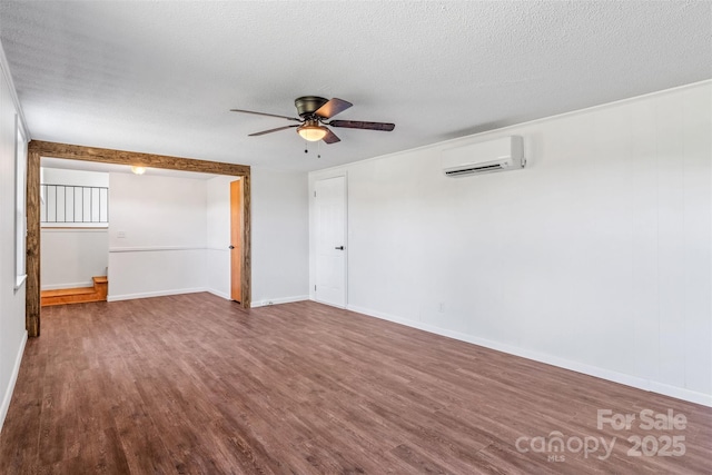 4980 Murray Rd, Winston Salem, NC 27106 - unfurnished room with a wall mounted AC, a ceiling fan, dark wood-style flooring, and a textured ceiling