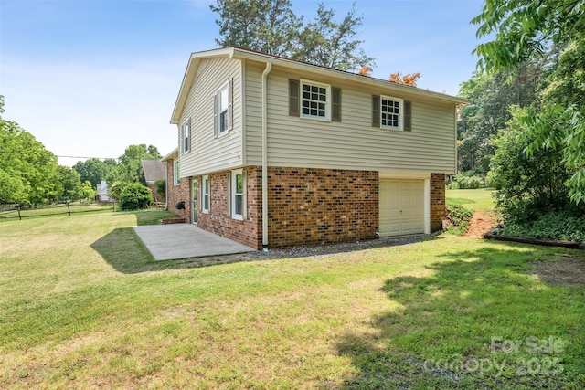 4980 Murray Rd, Winston Salem, NC 27106 - rear view of house with brick siding, a patio area, and a lawn