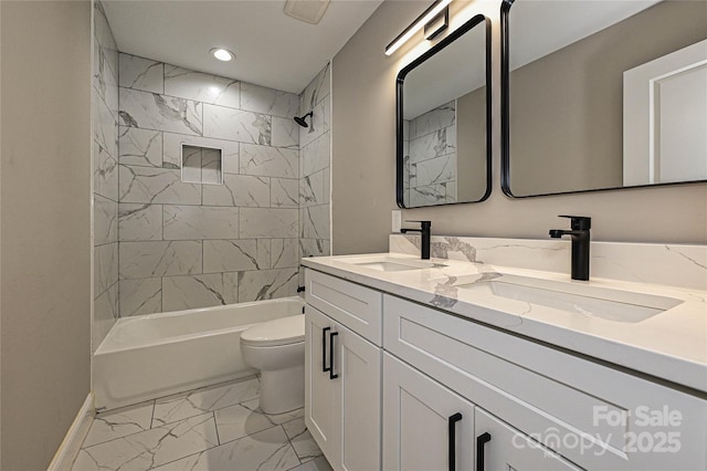 446 Mint St, Rock Hill, SC 29730 - bathroom with marble look tiles, toilet, double vanity, baseboards, and bathing tub / shower combination
