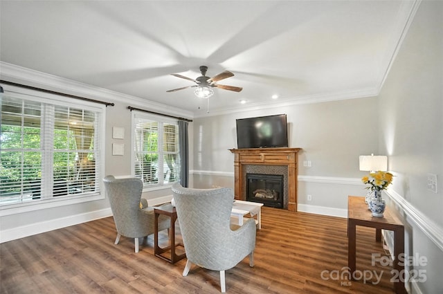 5916 Four Wood Dr, Matthews, NC 28104 - living area with wood finished floors, a glass covered fireplace, a ceiling fan, ornamental molding, and recessed lighting