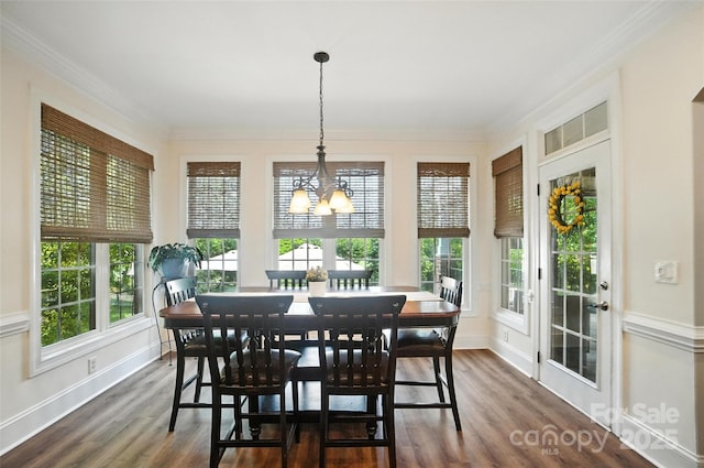 5916 Four Wood Dr, Matthews, NC 28104 - sunroom with healthy amount of natural light, wood finished floors, crown molding, and a chandelier