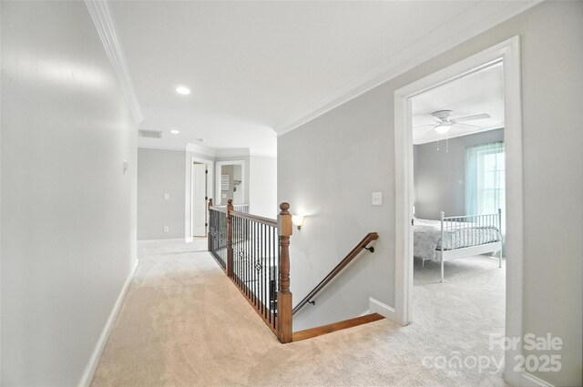 5916 Four Wood Dr, Matthews, NC 28104 - hallway featuring an upstairs landing, light carpet, ornamental molding, and recessed lighting