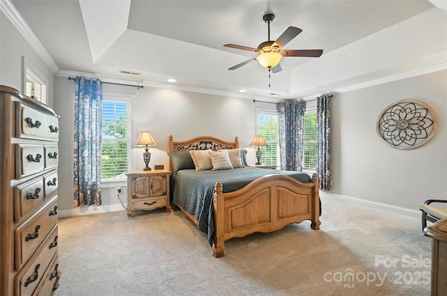 5916 Four Wood Dr, Matthews, NC 28104 - bedroom with a tray ceiling, multiple windows, light carpet, crown molding, and a ceiling fan